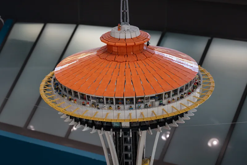 An orange model of the Space Needle on display.