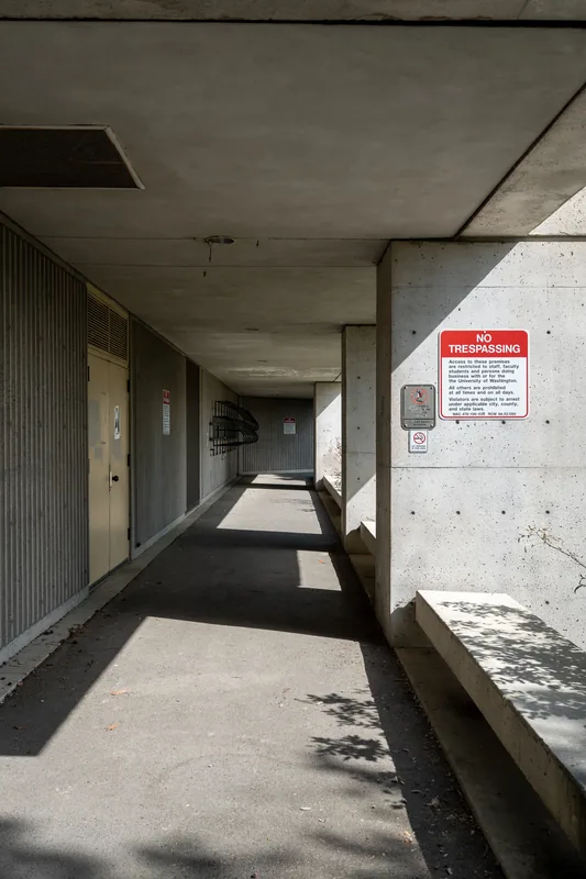 An open concrete corridor with strong shadows.