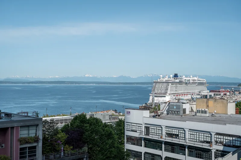 Waterfront buildings overlooking a blue bay.