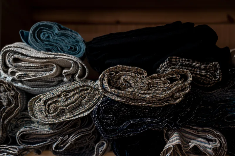 Coils of woven rope and textiles on display.