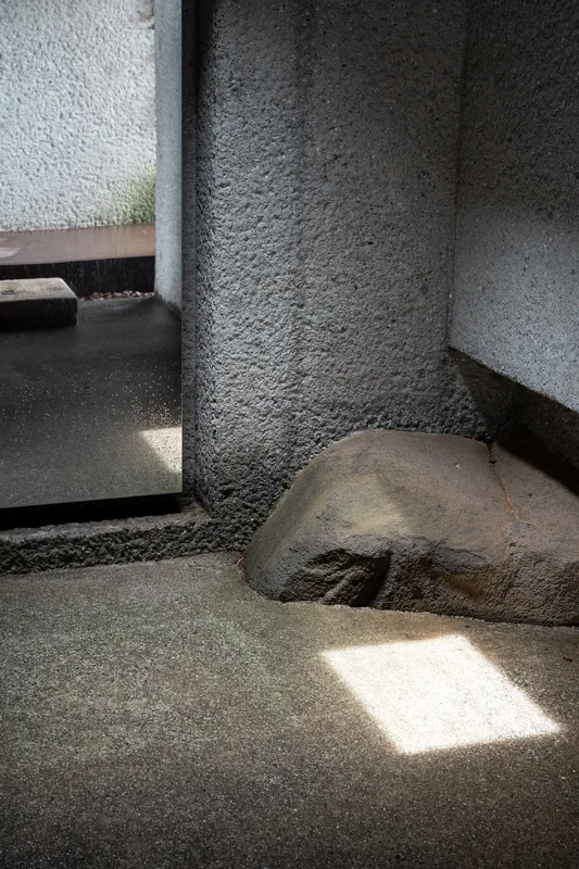 Sunlight falling into a shaded concrete interior.